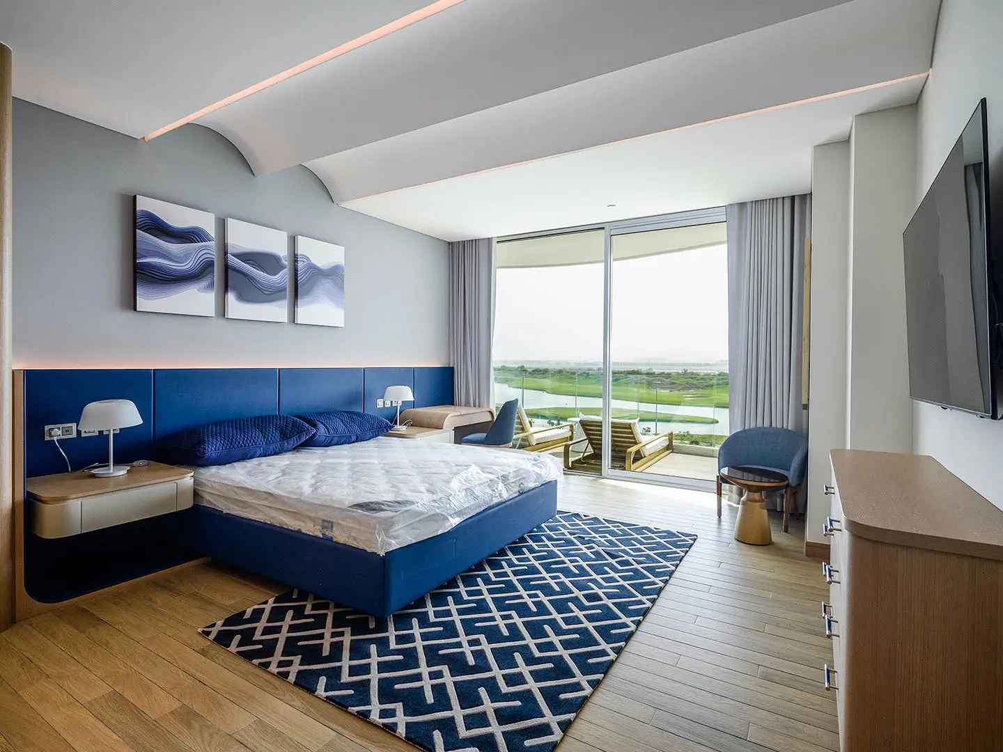 Spacious bedroom with large bed and minimal decor