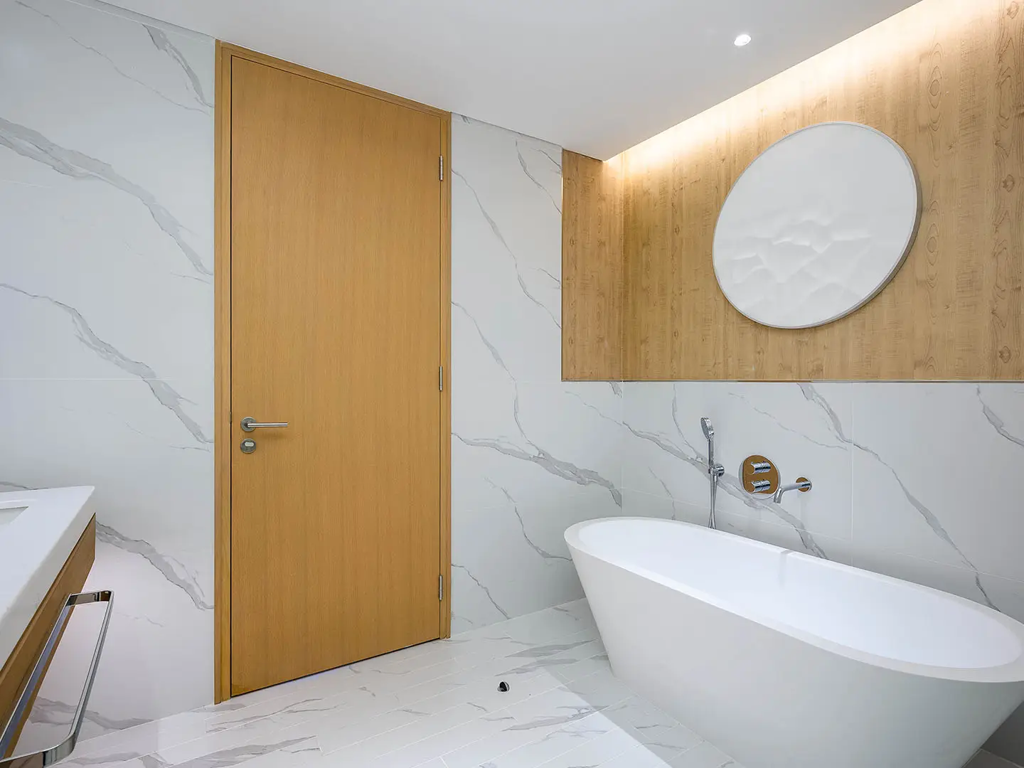 Bathroom with marble, wood, and bathtub