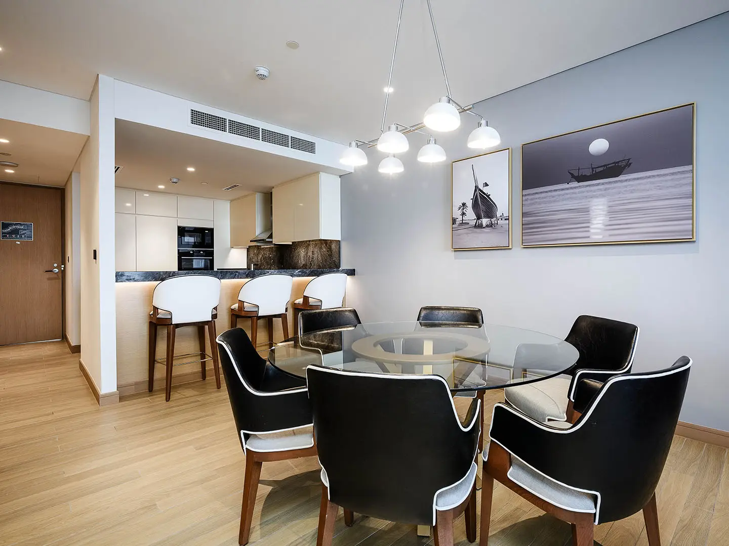 A dining area with a modern kitchen