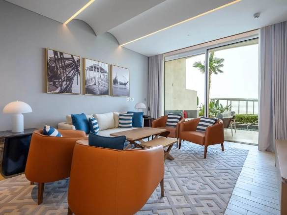 Living room with orange chairs and patio